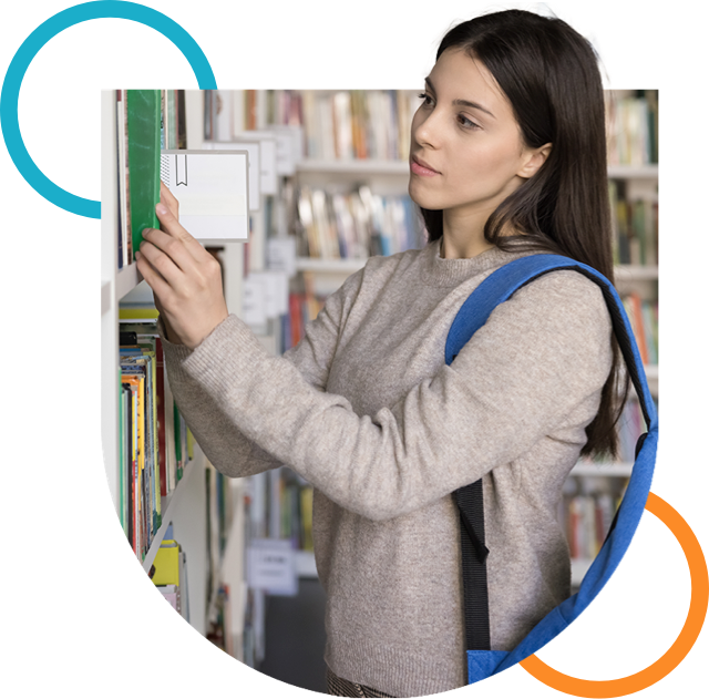 woman in higher education browsing institution library
